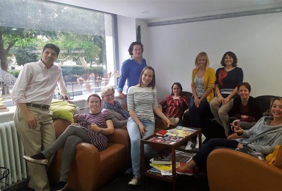 ECNL staff members (10) in an office space. 